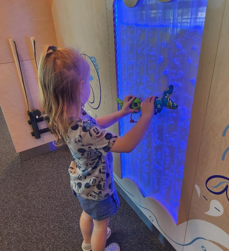 Toddler playing with interactive exhibit at Children’s Museum of the Desert in Palm Springs