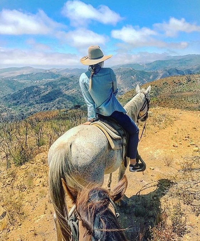 Woman riding a horse at Circle Bar B Santa Barbara