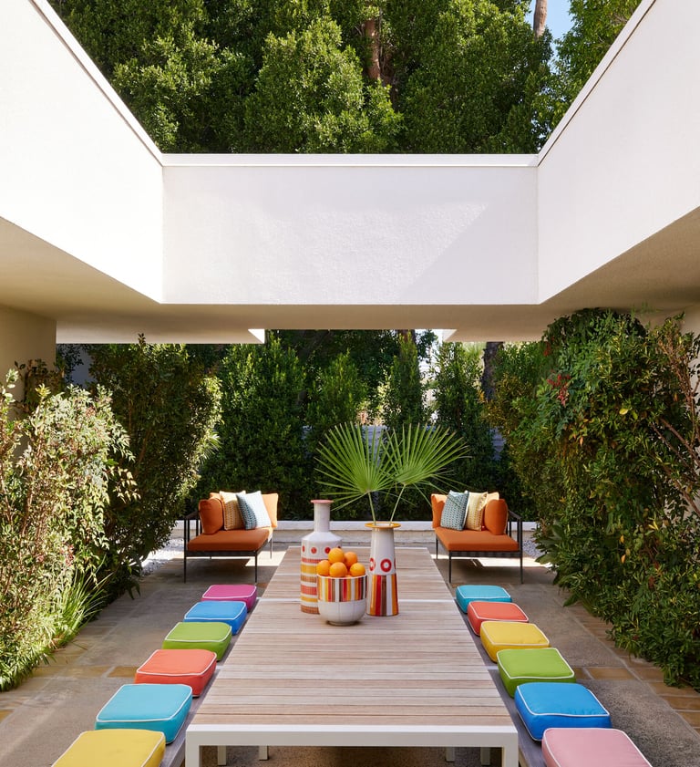 Colorful outdoor courtyard seating at Parker Palm Springs in Palm Springs, California, a stylish romantic getaway for couples