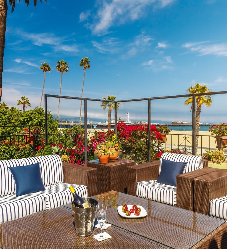 The Milo Santa Barbara outdoor lounge with champagne and strawberries overlooking the ocean