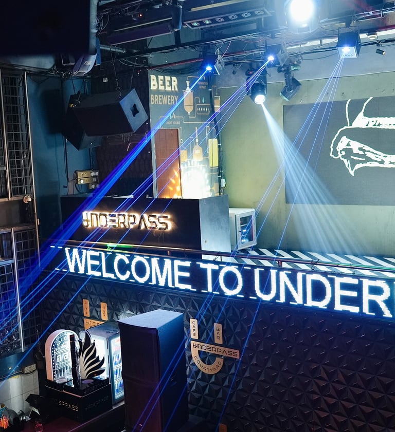 a bar with a large screen and a large screen