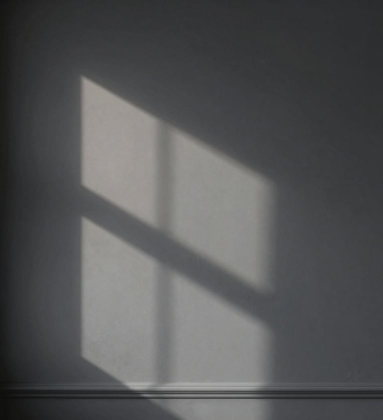 Abstract play of light and shadow on a matte dark grey wall, minimalist composition, soft professional lighting, elegant architectural detail, European / Spanish style.