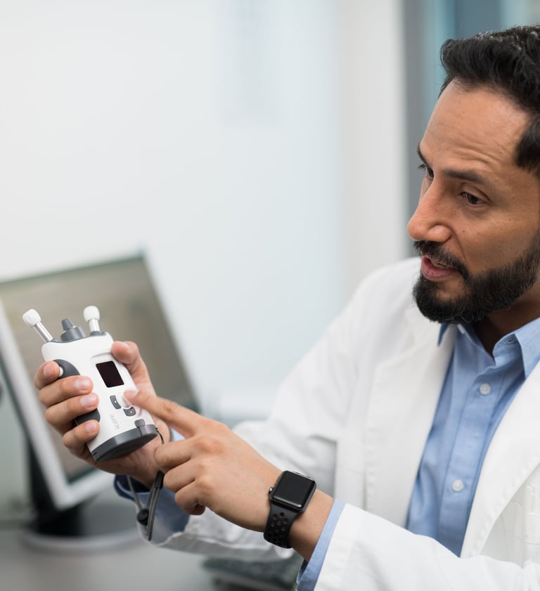 Doctor showing an iCare HOME2 tonometry device for measuring eye pressure IOP.