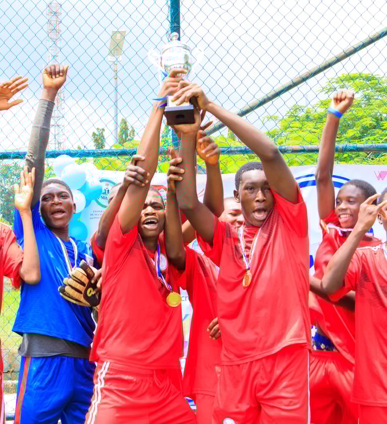 a group of young men and women soccer players holding up a trophy