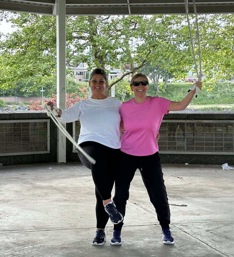 2 old women waving ropes smiling in fitness clothes