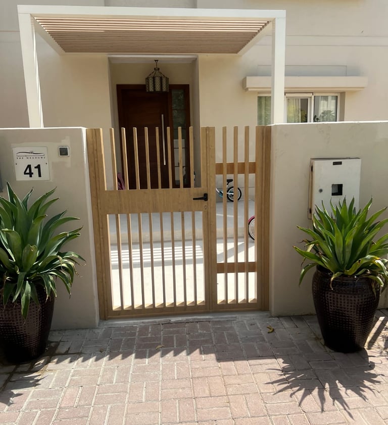 Single leaf luxury cast aluminum pedestrian gate for small villa entrance.
