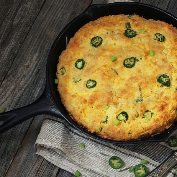 Mexican Cornbread (Pan de Elote) in an iron skillet