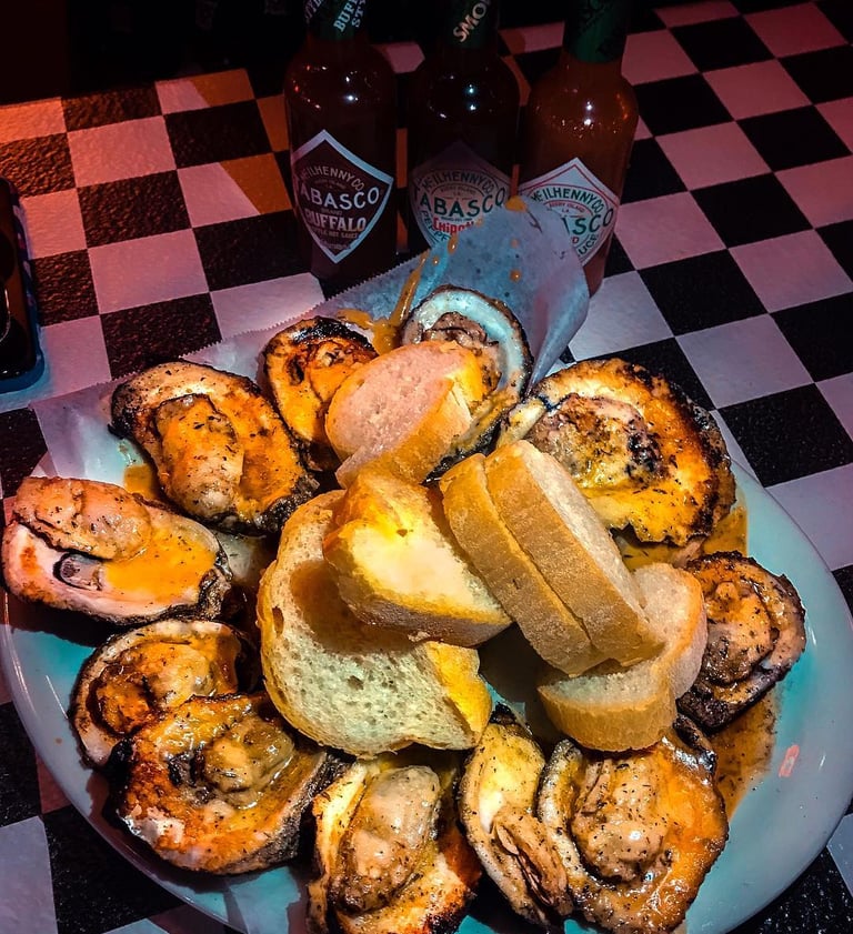 Acme Oyster House oysters on a plate