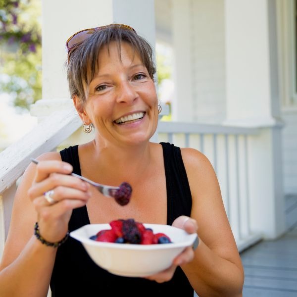 woman eating berries