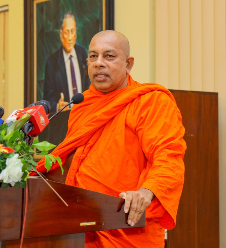 a monk in a red robe and a microphone