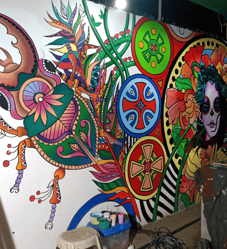 a large mural of a woman's face and a insects