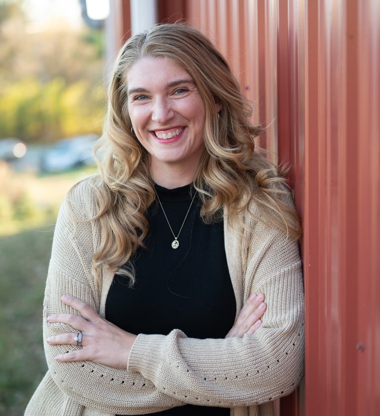 a woman in a black sweater and a white sweater
