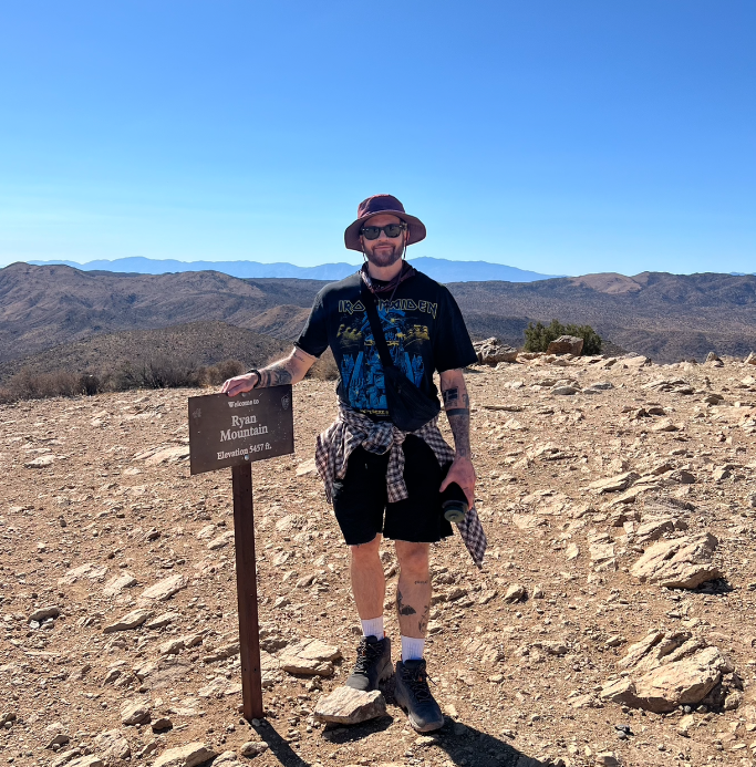 Stoke of Wellness about section. Man hiking a mountain.