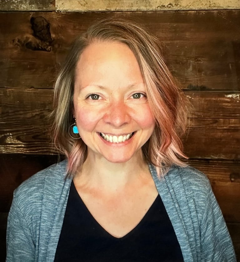 Image of Dr. Erika smiling against brown wood background