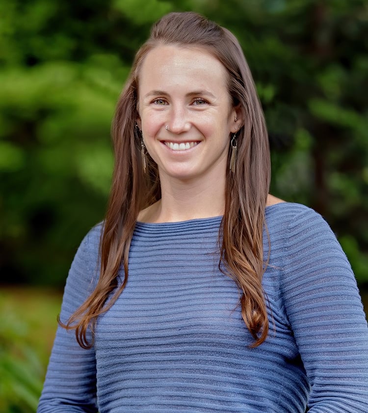 Image of Dr. Allie smiling against green outdoor background