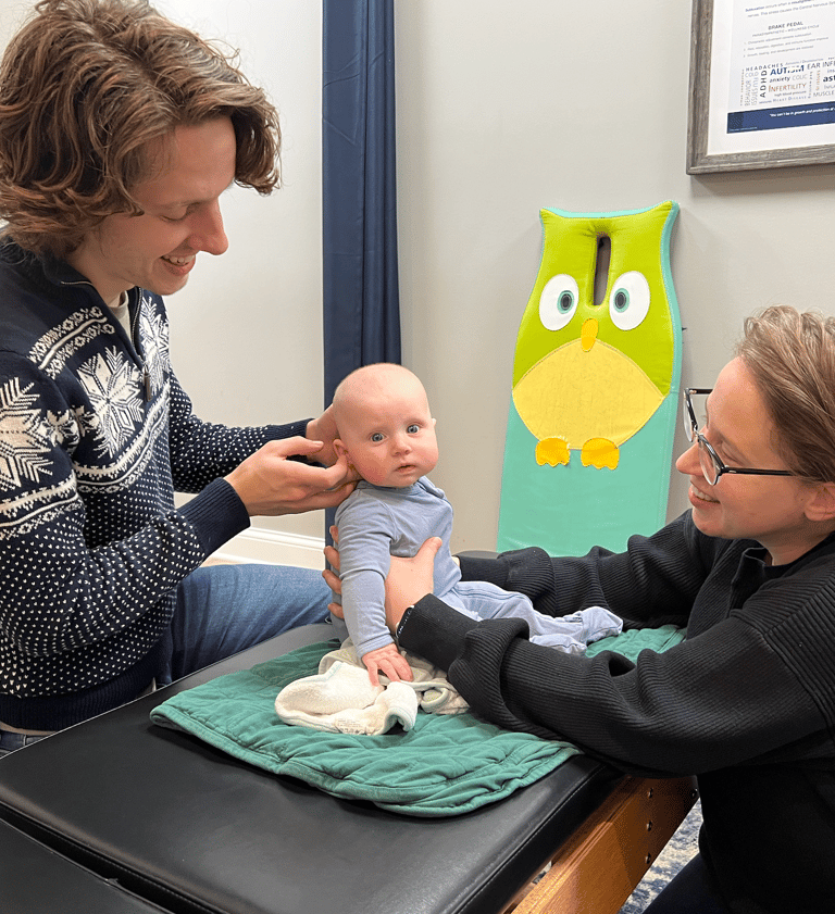 Franklin pediatric chiropractor adjusting baby to help with ear infections.