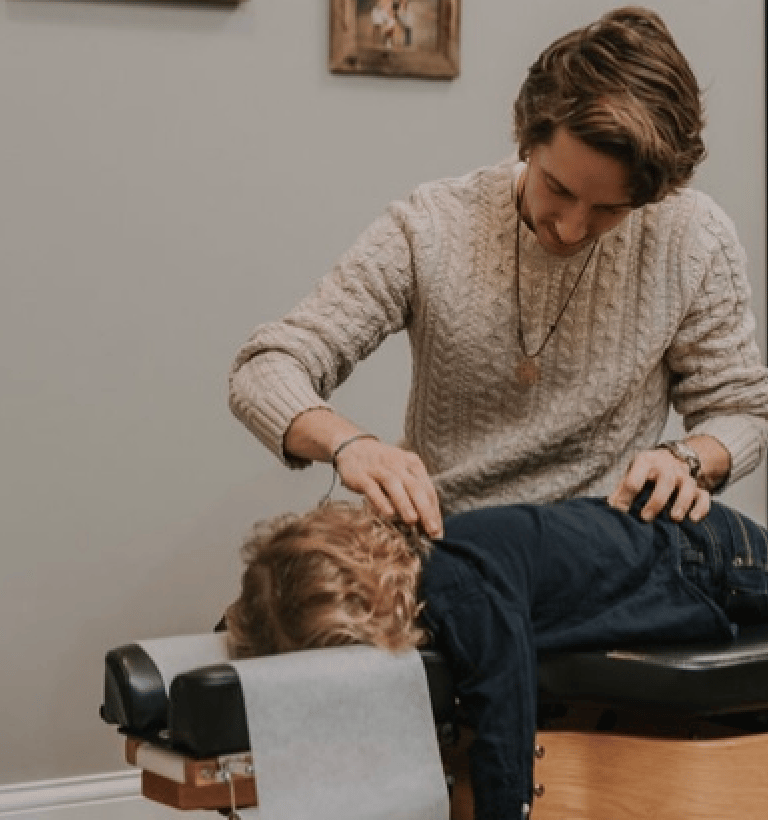 Child who is struggling with sleep and energy issues calmly getting adjusted in Franklin, TN