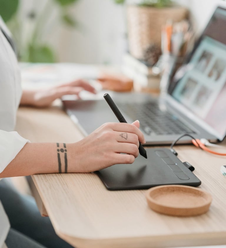 a woman sitting at a desk with a pen and a pen