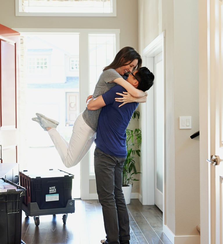 a man and woman are kissing in a hallway