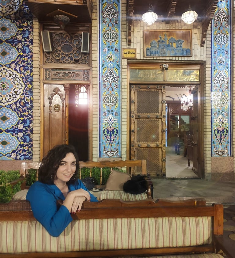 a woman sitting on a couch in a room