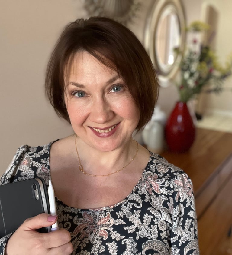 a woman in a floral dress holding a tablet