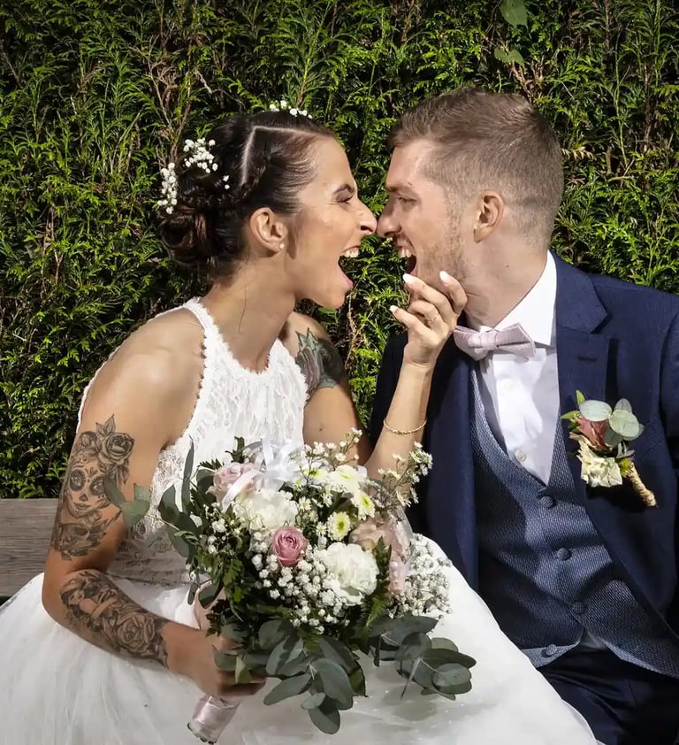 fantastic wedding photographer florent lille saint omer  paris a bride and groom kissing on a bench 