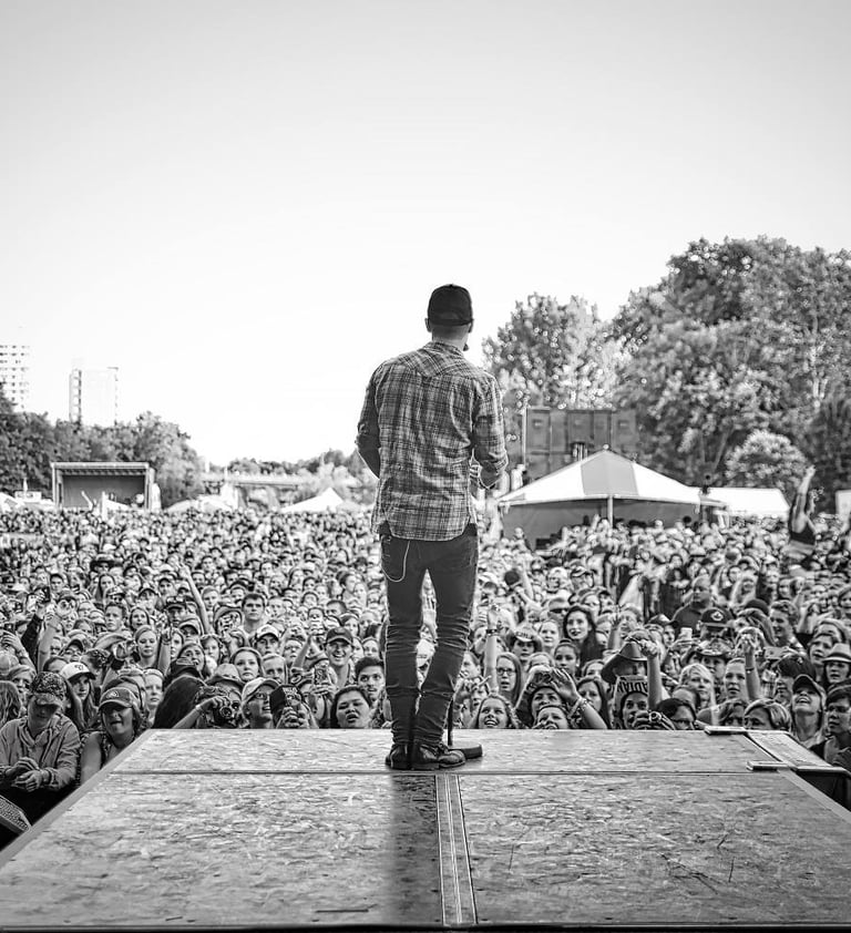 Dallas Smith overlooking a large crowd at Rock The Park in London, Ontario, Canada.