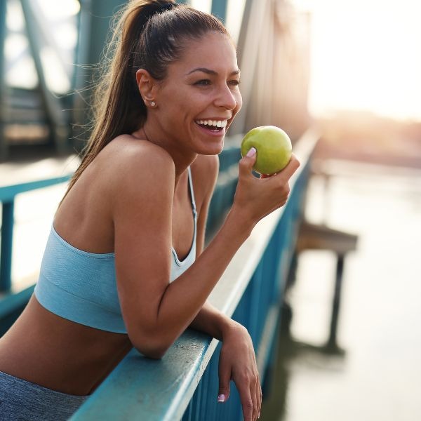 woman holding an apple