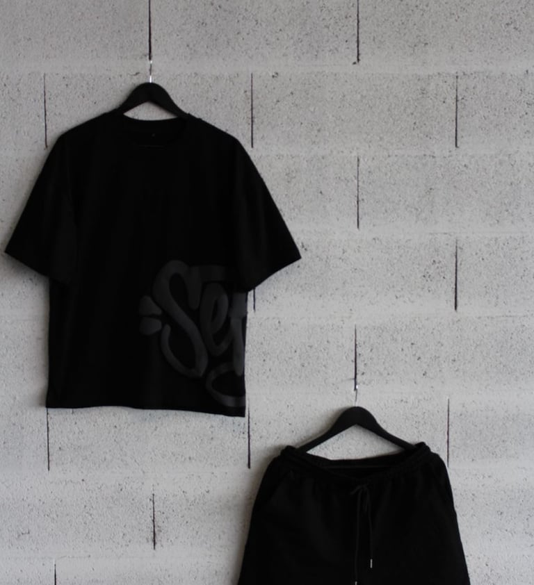 a black and white shirt and shorts with a black and white shirt