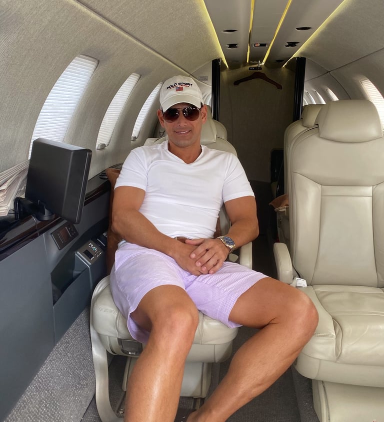 Rick Rockefeller-Silvia sitting in a private jet