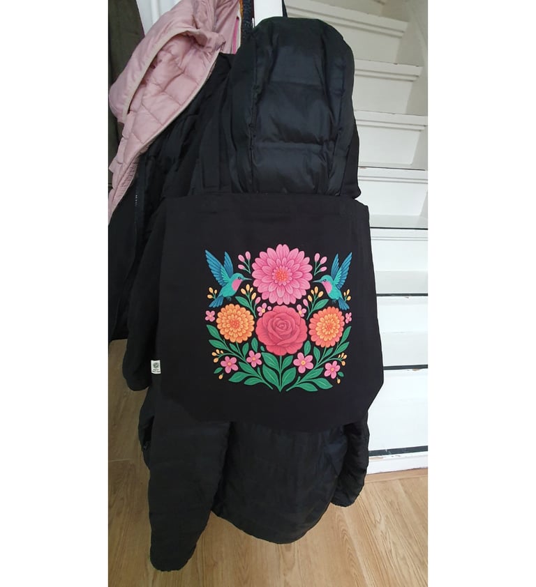 user review floral courage eco tote bag haning on black jacket