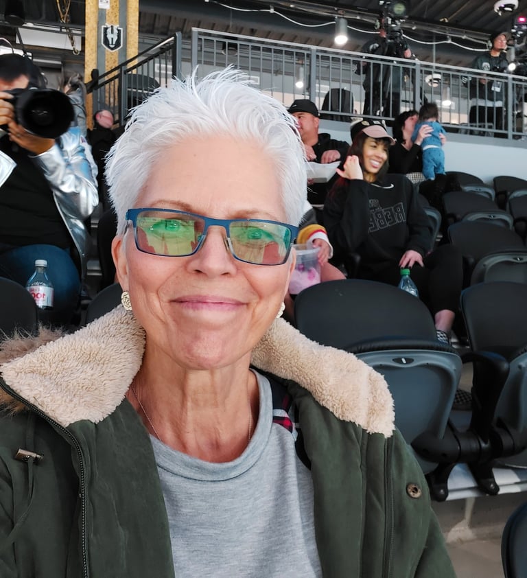 Mrs. M in the stands cheering on her favorite ice hockey team!