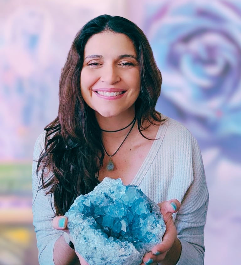 Veronica Dennis holding a large blue crystal stone