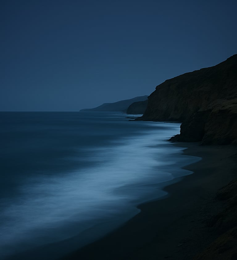 A serene coastal landscape in South America at dusk, where the dark navy sky meets the steel blue ocean, captured with professional long-exposure photography.