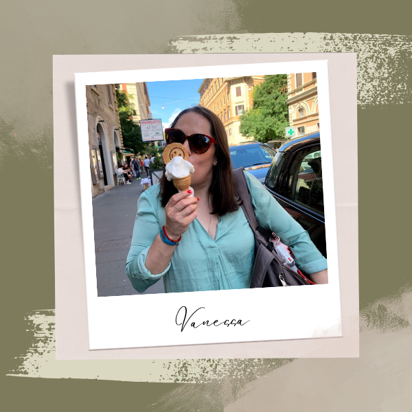 a woman in sunglasses and sunglasses eating a donut
