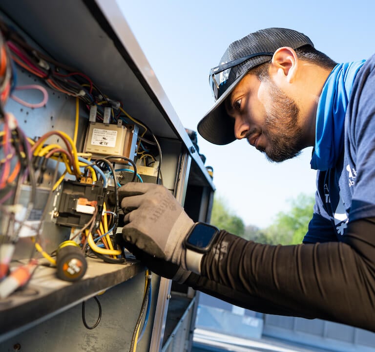 HVAC technician serving a commercial ac unit in Nashville Tennessee