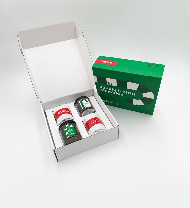 Eurovaistine Christmas gift box with tea and white socks on a white background.