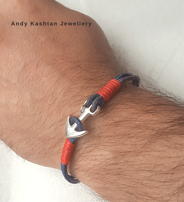 Handmade men's nautical anchor bracelet with silver clasp and blue and red cord.
