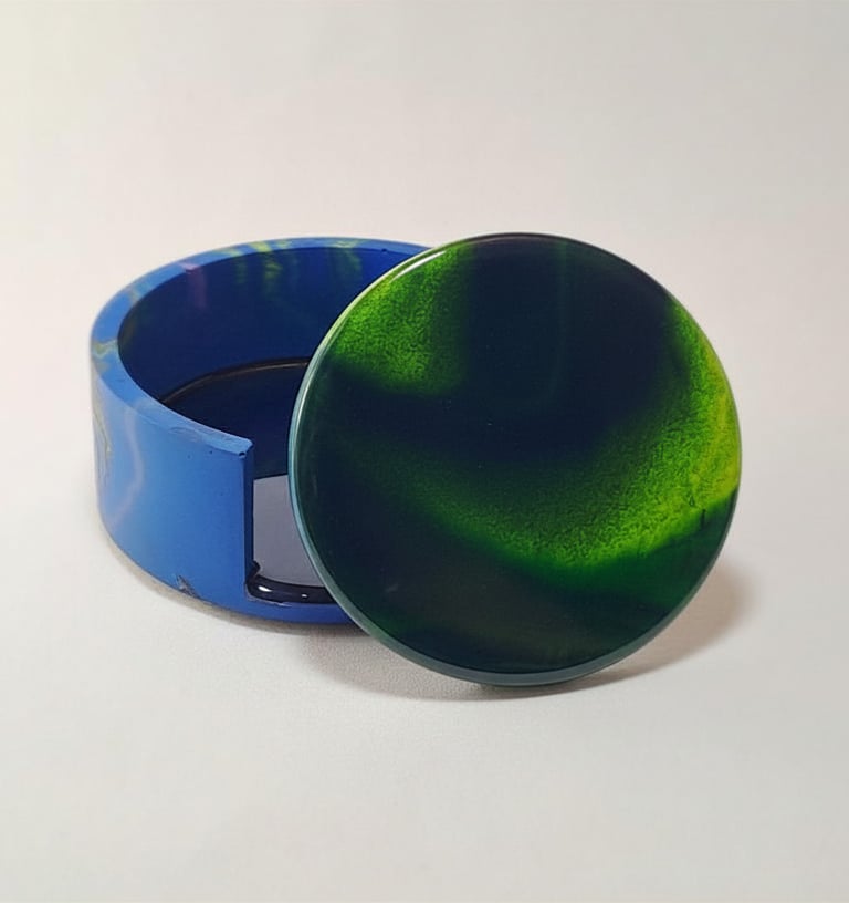 Handmade green and blue swirl resin coaster set with matching holder with northern lights design.