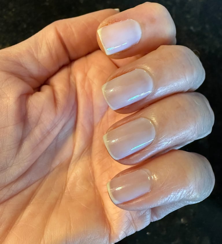 One coat of sheer nail polish giving a clean, natural, healthy looking finish on the nails.