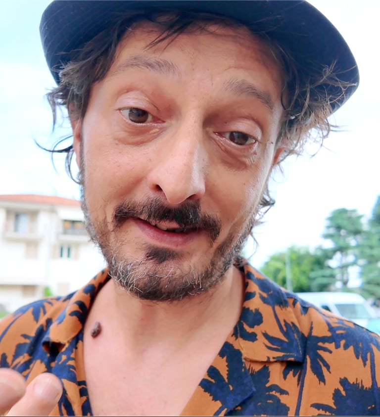 a man with a hat and a hat on