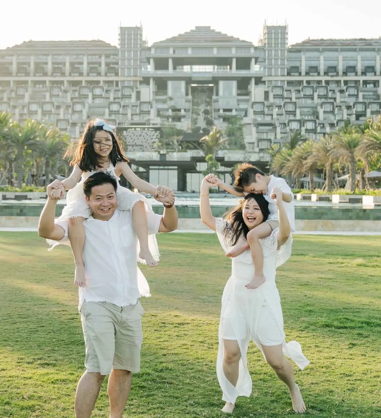 Playful family photography on the Ocean Lawn at The Apurva Kempinski Bali during golden hour