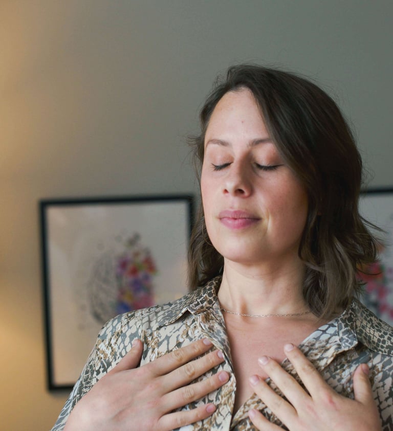 woman with short hair and eyes closed showing embodiment practices 