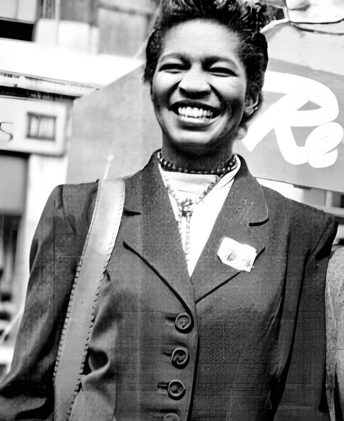 Smiling Claudia Jones representing the They Did I Can Too Creatives pioneers and icons section.