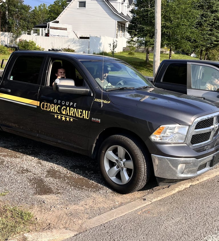 2 company trucks with employees