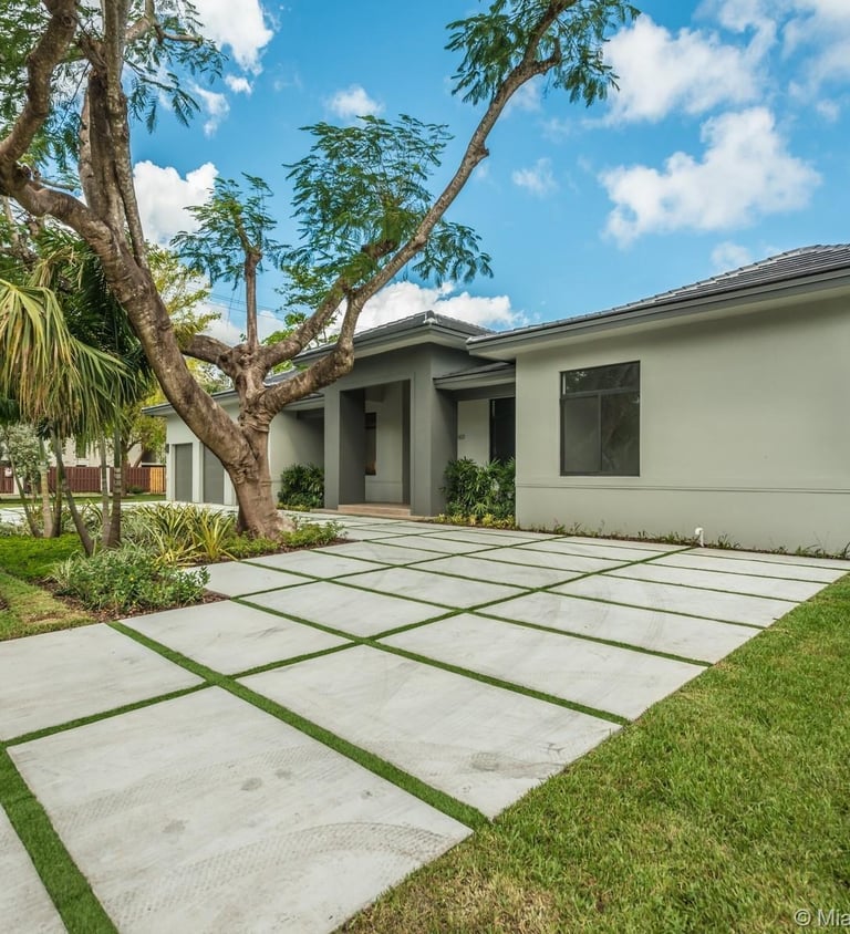 a custom designed green luxury house witha large spacious front yard