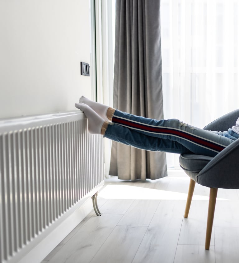 a woman sitting in a chair with her legs up