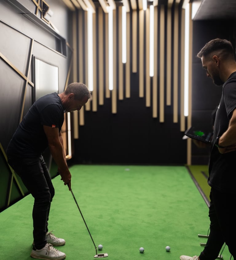 an indoor golf simulator venue with a Zen putting stage