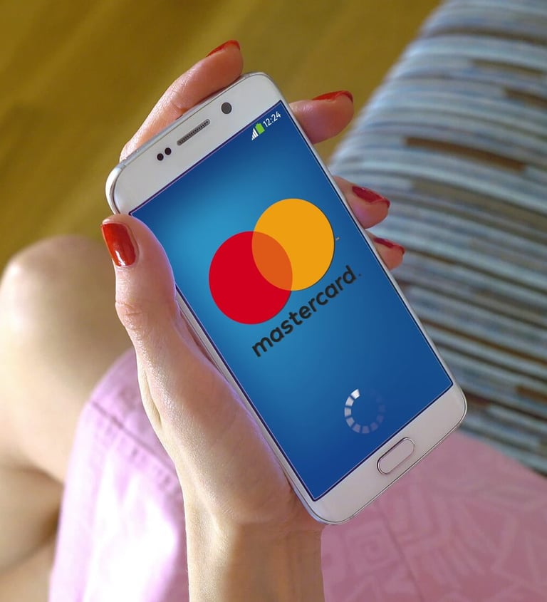 a woman holding a cellphone making a bank transfer