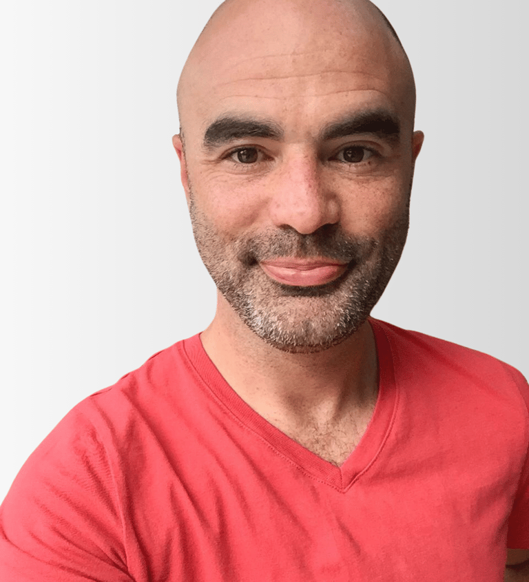 Brian Tyson, a man with a bald head and a red t-shirt